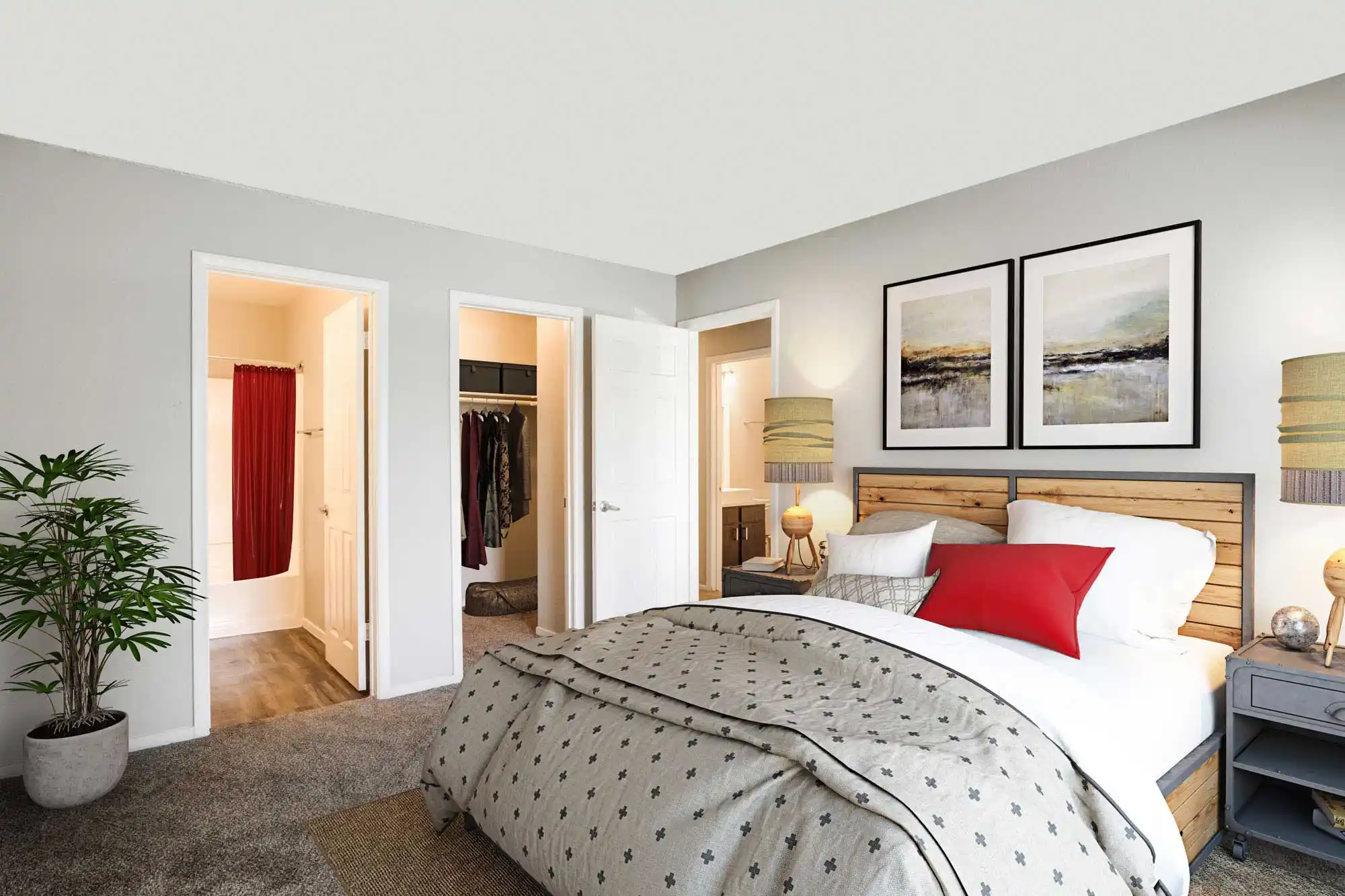 Fifty 101 Apartments apartment bedroom with bed, walk-in closet, and bathroom entrance